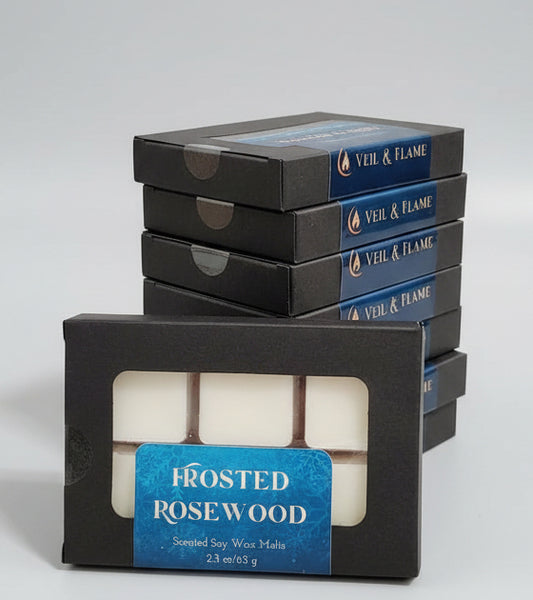 Box of Frosted Rosewood wax melts in on a table with a blurred background