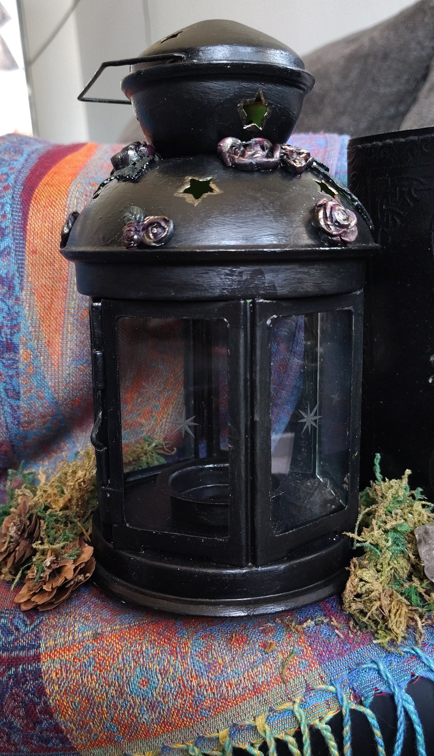 Vintage-style lantern on a textured surface with a blurred background