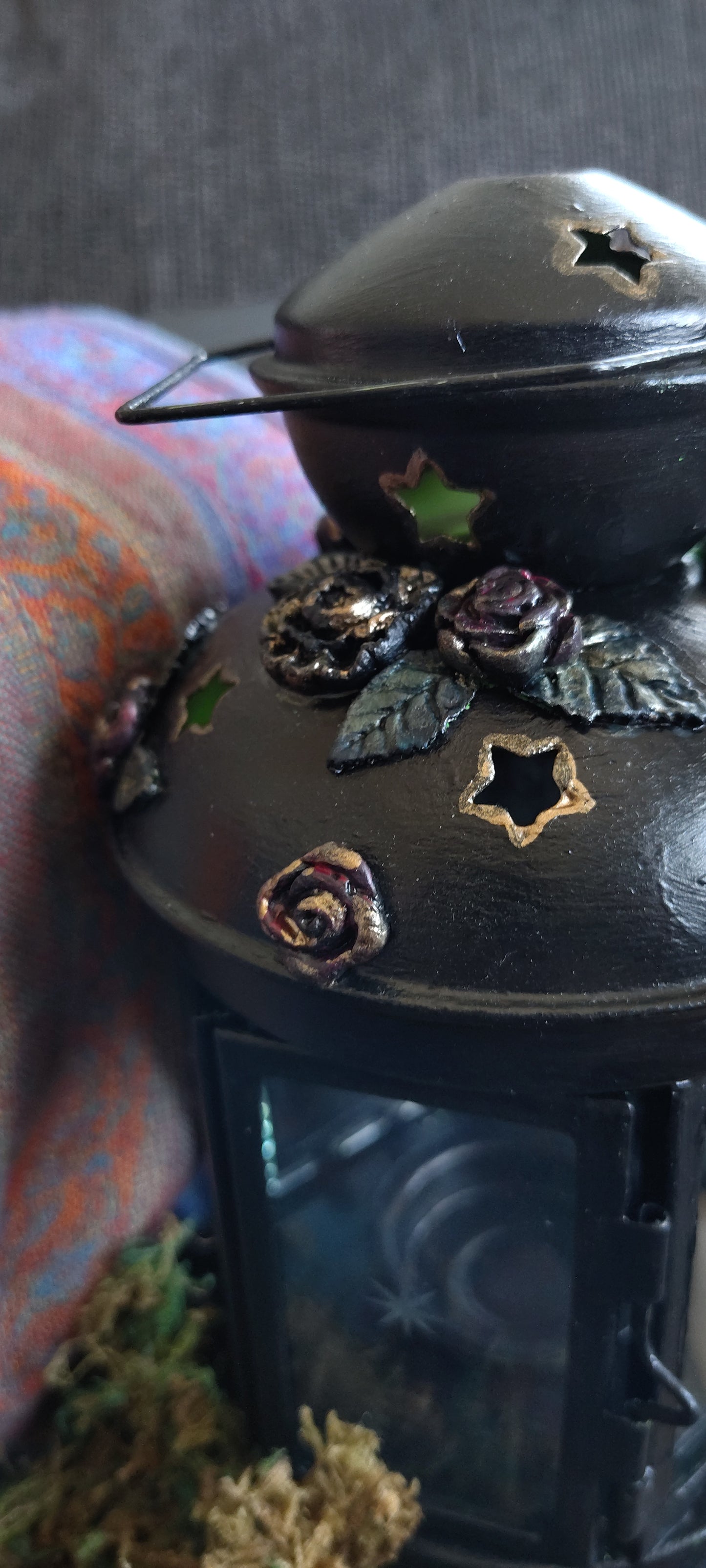 Close-up of a decorative object with floral patterns on a textured surface